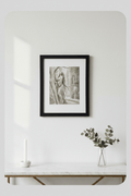 Whispers in the Marble Garden framed print displayed on a white wall above a marble console table with candle and eucalyptus
